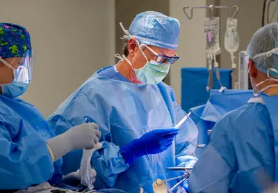 Dr. James Eason performs a liver transplant surgery.